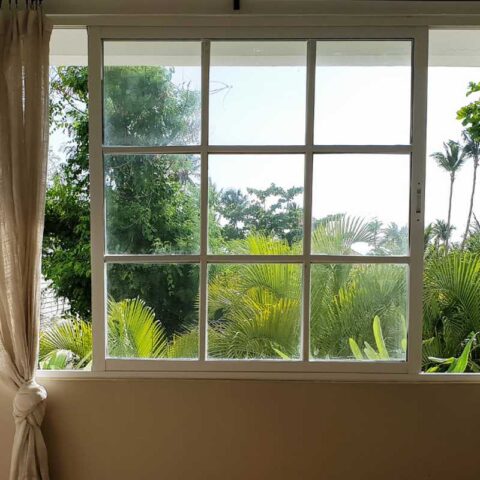 Vinyl replacement window with garden view, part of a clear upfront pricing quote in Overland Park